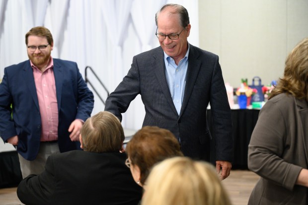 Indiana Gov. Mike Braun shakes hands with attendees to the Munster Chamber of Commerce's May membership meeting on Thursday, May 8, 2025. (Kyle Telechan/for the Post-Tribune)