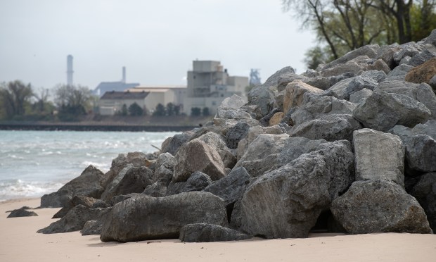 Stones put in place to try to halt the erosion of sand along the Lake Michigan shoreline in Ogden Dunes, Indiana Tuesday April 29, 2025. Ogden Dunes started constructing a stone revetment wall despite an ongoing legal challenge with Save the Dunes over whether the project violates the public trust.(Andy Lavalley/for the Post-Tribune)