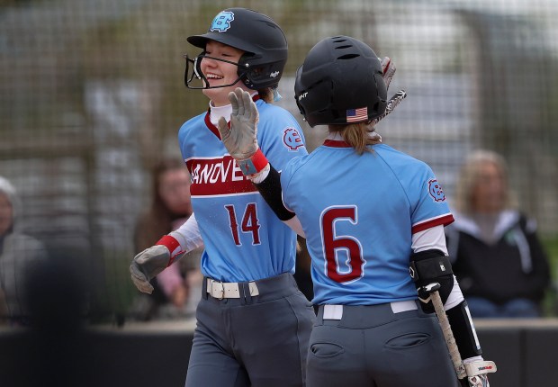 Hanover Central's Jillian DeYoung gets a high-five from teammate Adeline McMahon