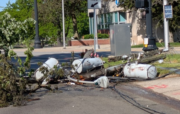 Trees and a utility transformer pole near St. Bridget's Catholic Church at 2nd and Main streets in Hobart were downed in Thursday night's thunderstorms. (Carole Carlson/Post-Tribune)