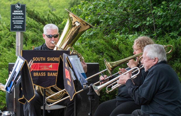 South Shore Brass Quintet members Wayne Coil, left, Kristen Engelbert and Larry Lane play during the Memorial Day ceremony at the Service Memorial at Foundation Meadows in Valparaiso, Indiana, Friday, May 23, 2025. (Andy Lavalley/for the Post-Tribune)