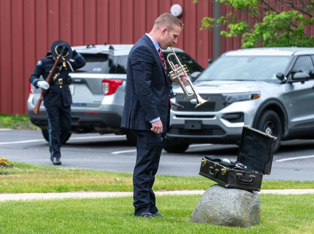 Chris Hammer warms up prior to the start of the Memorial Day ceremony at the Service Memorial at Foundation Meadows in Valparaiso, Indiana, Friday, May 23, 2025. Hammer, a Porter County deputy prosecutor, played Taps at the end of the service. (Andy Lavalley/for the Post-Tribune)