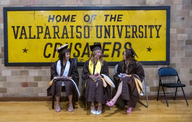 Brielle Wilkins, Reilly Ritter and Sandra Carlsten (left to right) chat before the start of the 2025 conferring of degrees ceremony at Valparaiso University in Valparaiso, Indiana, Saturday, May 10, 2025. (Andy Lavalley/for the Post-Tribune)