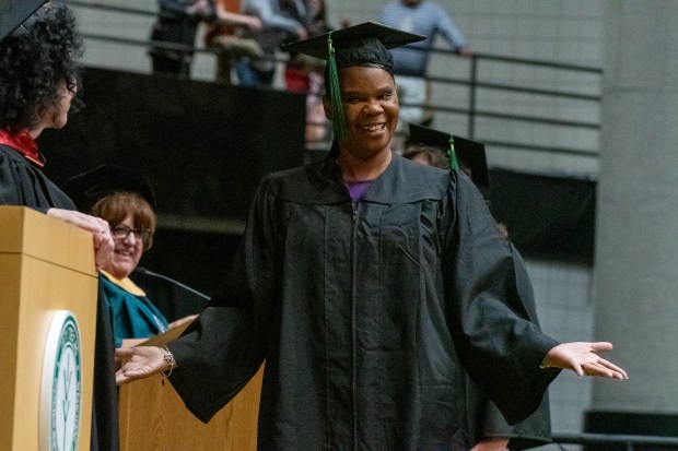 Betty Ferguson, of Gary, reacts to cheers from friends and family as she walks up to accept her nursing degree during the spring 2025 Ivy Tech Community College commencement ceremonies at the Athletics-Recreation Center on the campus of Valparaiso University in Valparaiso, Indiana, Thursday, May 8, 2025. (Andy Lavalley/for the Post-Tribune).