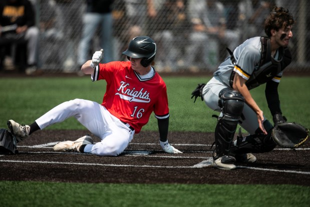 Lincoln-Way Central's Conor McCabe (16) slides in from the Knights' lone run as Andrew's Robby Pursel waits for the throw during the Class 4A Andrew Regional final in Tinley Park on Saturday, May 31, 2025. (Vincent D. Johnson / for the Daily Southtown)