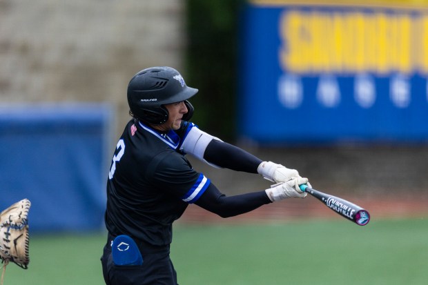 Lincoln-Way East's Evan Riiff (3) connects for an RBI single against Sandburg during a Southwest Suburban Conference game in Orland Park on Wednesday, May 21, 2025. (Vincent D. Johnson / for the Daily Southtown)