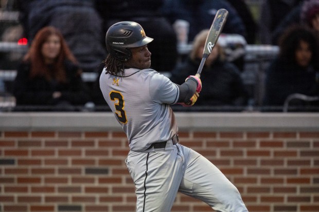Marian Catholic's Jonathan Trotter (3) connects on a pitch from Homewood-Flossmoor during a nonconference game in Flossmoor on Friday, May 2, 2025. (Vincent D. Johnson / for the Daily Southtown)