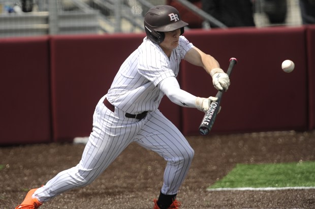 Brother Rice's Anthony Cartolano (5) lays down sacrifice bunt against Providence during a Chicago Catholic League game Saturday, May 10, 2025 in Chicago, IL. (Steve Johnston/for the Daily Southtown)