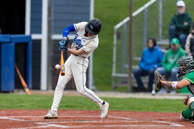 Lincoln-Way East's Tyler Hudik (7) connects on a pitch against Providence during a nonconference game in Frankfort on Wednesday, April 30, 2025. (Vincent D. Johnson / for the Daily Southtown)