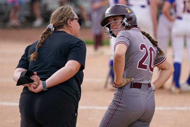 Lockport assistant coach Angela (Findlay) Ashman, left, talks to Taylor Lane (20) during a break in play in a Southwest Suburban Conference game against Sandburg at Flink Field in Lockport on Monday, May 12, 2025. (Sean King / for The Daily Southtown)