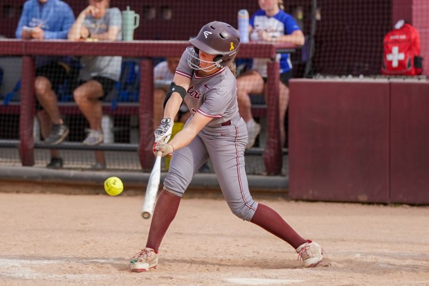 Lockport's Taylor Lane reaches to make contact on a pitch against Sandburg Southwest Suburban Conference game at Flink Field in Lockport on Monday, May 12, 2025. (Sean King / for The Daily Southtown)