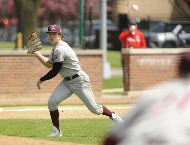 Brother Rice's pitcher Braydon McKendrick (11) fields a come backer and makes the throw to first base for the out against St. Rita during a Chicago Catholic League game Saturday, May 3, 2025 in Chicago, IL. (Steve Johnston/for the Daily Southtown)