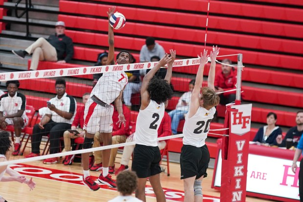 Homewood-Flossmoor's Surendran Heyward (7) goes up for a kill attempt against Andrew's Jeremiah Richardson (2) and Elijah Hoekstra (20) during a SouthWest Suburban Conference volleyball match at Homewood-Flossmoor High School on Thursday, May 1, 2025. (Sean King / for The Daily Southtown)