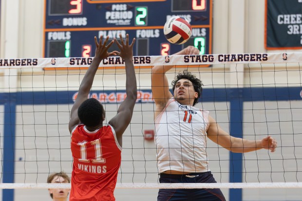 Stagg's Tulal Johjah (11) spikes the ball against Homewood-Flossmoor during a Southwest Suburban Conference game in Palos Hills on Tuesday, May 6, 2025. (Troy Stolt for the Daily Southtown)