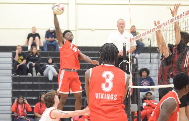 Homewood-Flossmoor's Ahmad Powell (14) goes for a kill against T.F. United during a Rich Township Regional semifinal in Richton Park on Tuesday, May 27, 2025. (Jeff Vorva / Daily Southtown)