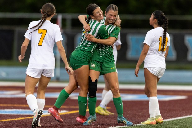 Providence's Alyssa Thulin, left, hugs Providence's Maggie Wolniakowski, after she scored the Celtics' third goal against St. Laurence during the Class 3A Kankakee Sectional final in Kankakee on Friday, May 30, 2025. (Vincent D. Johnson / for the Daily Southtown)