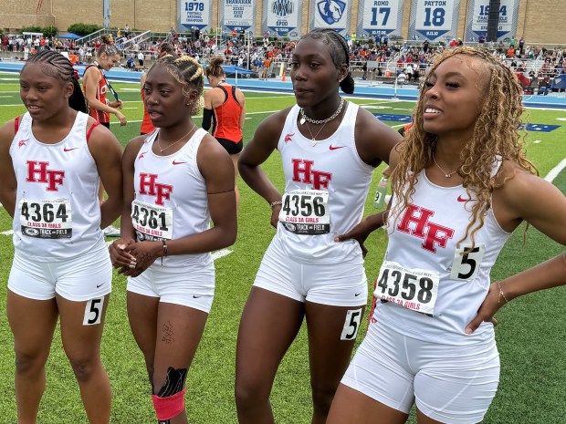 Homewood-Flossmoor's London Willingham, Mariyah Robinson, London Jarrett and Aniya Mullins, from let, gather minutes after setting a record in the 400 meter relay in the girls track state meet at Eastern Illinois in Charleston on Saturday, May 24, 2025. (Jeff Vorva / Daily Southtown)