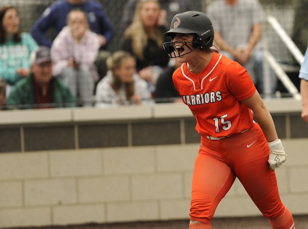 Lincoln-Way West's Abby Brueggmann (15) lets out a scream after scoring the second run for the Warriors against Andrew during the Class 4A Andrew Regional final Friday, May 30, 2025 in Tinley Park, IL. (Steve Johnston/for the Daily Southtown)