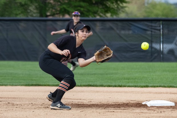 Lincoln-Way West's Reese Rourke (21) catches a throw from first base against Homewood-Flossmoor during a Southwest Suburban Conference game in New Lenox on Thursday, May 1, 2025. (Troy Stolt for the Daily Southtown)