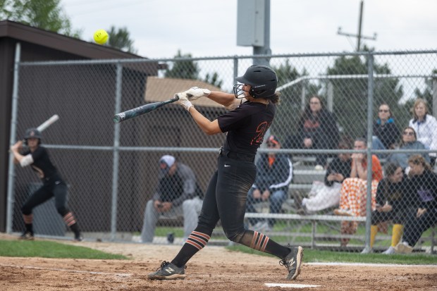 Lincoln-Way West's Reese Rourke (21) hits the ball against Homewood-Flossmoor during a Southwest Suburban Conference game in New Lenox on Thursday, May 1, 2025. (Troy Stolt for the Daily Southtown)