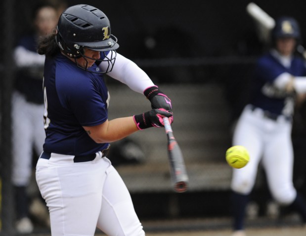 Lemont's Natalie Pacyga (18) connects for a hit against Oak Lawn during a South Suburban Conference game Wednesday, May 21, 2025 in Lemont, IL. (Steve Johnston/for the Daily Southtown)