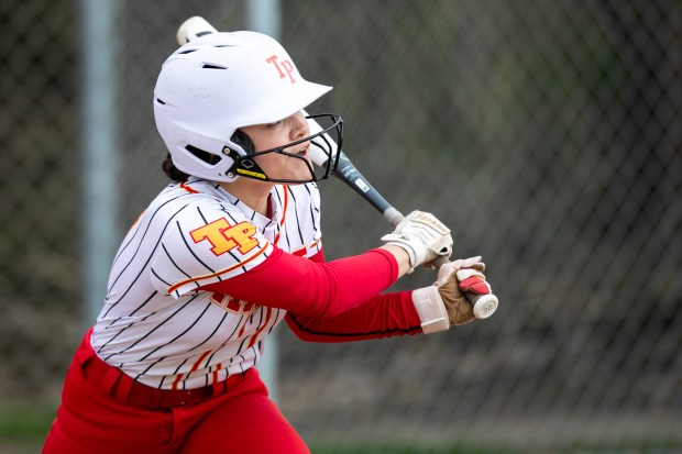 Tinley Park's Lilia Flores (2) looks up after hitting the ball to centerfield for a hit against Mother McAuley during a nonconference game in Tinley Park on Friday, May 2, 2025. (Vincent D. Johnson / for the Daily Southtown)