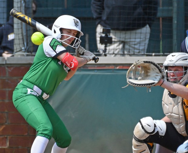 Providence Catholic's Ella Kucala is hit by a pitch during the Class 3A Providence Regional final game against Marian Catholic on Saturday, May 31, 2025 in New Lenox.(Jon Cunningham for the Daily Southtown)