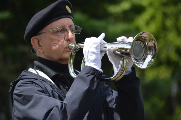 Blue Island American Legion's Jerry Dagenais performs taps at the Memorial Day ceremony May 26, 2025, at Memorial Park. (Jeff Vorva/for the Daily Southtown)