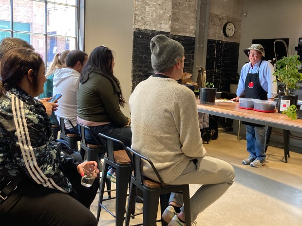 Bob Zeni, of La Grange Park, aka Chicago Tomato Man, conducts a gardening workshop at Tomatopalooza! April 26 at The Roof Crop in Chicago's Fulton Market District. Zeni's tomato operation has grown to where he distributes over 15,000 heirloom tomato plants annually. (Wendy S. Zeni)