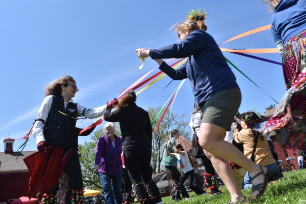 The May Day celebration May 3, 2025, at the Stellwagen Farm in Orland Park culminated with a Maypole dance, wherein the Pullman Morris dancers and visitors gathered up colorful strips of cloth and wrapped them around a pole. (Jesse Wright/for the Daily Southtown)