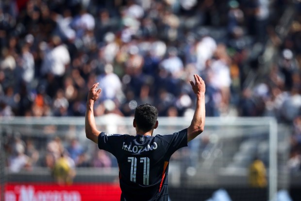 San Diego FC midfielder Hirving Lozano (11) gestures to the crowd after his winning goal against the L.A. Galaxy at Snapdragon Stadium on Saturday. (Meg McLaughlin / The San Diego Union-Tribune)