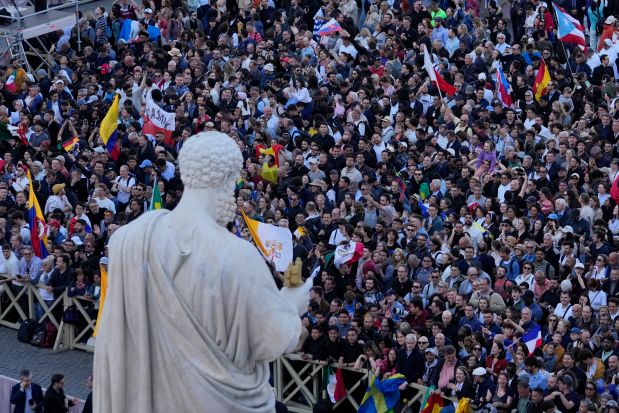 Crowds cheer in St. Peter's Square after the election of the 267th pontiff of the Roman Catholic Church, at the Vatican, May 8, 2025. (Gregorio Borgia/AP)