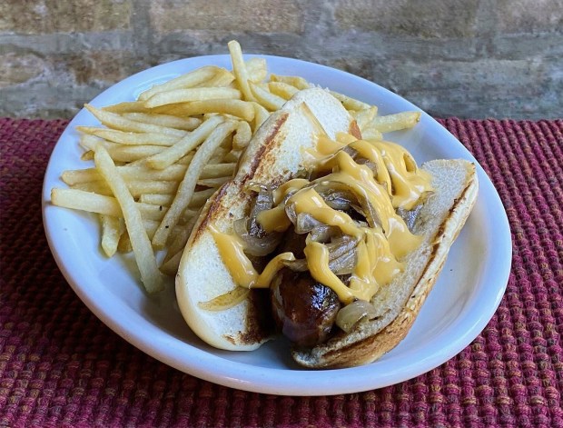 Mac's Wood Grilled smoked cheddar brats with fries. (Terri Mooney)