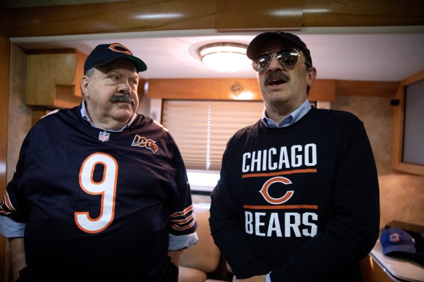 Actor, writer, producer and director Robert Smigel, right, and actor George Wendt speak during an interview on Aug. 19, 2019, outside Soldier Field in Chicago. Two two were filming a segment of "Bill Swerski Super Fans," the "Saturday Night Live" sketch in which they play Bears fans. (Erin Hooley/Chicago Tribune)