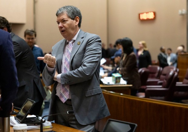 Ald. Brian Hopkins, 2nd, talks to colleagues before a City Council meeting, April 16, 2025, at City Hall. (Brian Cassella/Chicago Tribune)