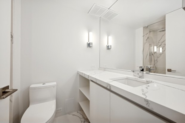 This five-bedroom, four-and-a-half bath home on the 70th floor of the Residences at Water Tower was recently listed for nearly $3.5 million. (VHT Studios)