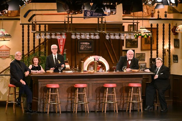 Ted Danson, Kelsey Grammer, Rhea Perlman, John Ratzenberger, George Wendt, and Anthony Anderson perform onstage at the 75th Emmy Awards on Jan. 15, 2024 at the Peacock Theater in Los Angeles. (Phil McCarten/Invision for the Television Academy/AP)