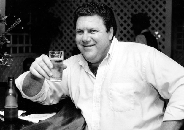 Actor George Wendt, who played Norm on the long-running sitcom "Cheers,'' poses with a glass of beer on June 13, 1983 in Los Angeles. (Wally Fong/AP)