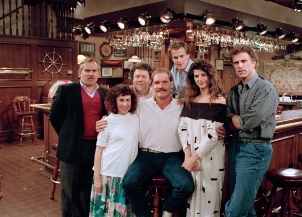 Boston Red Sox third baseman Wade Boggs, center, poses, March 2, 1988, with the cast of "Cheers" during rehearsal for an episode in which he appears. (Ira Mark Gostin/AP)