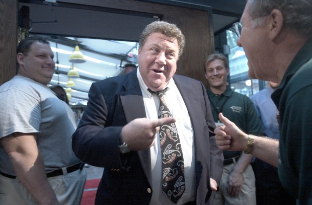 Actor George Wendt, known as Norm on the sitcom "Cheers", enters the doors of the "Cheers" bar on Aug. 23, 2001, on it's opening night in Boston. (Darren McCollester/Getty)