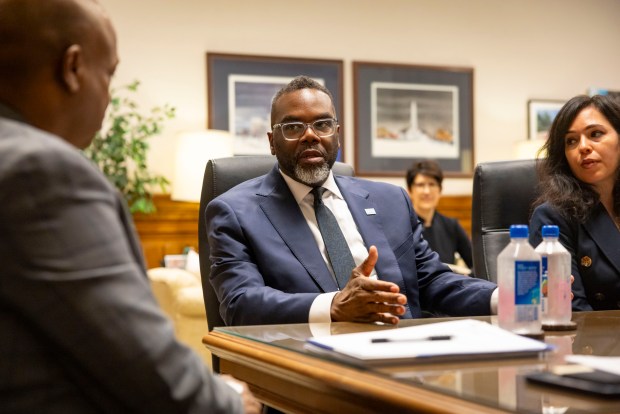 House Speaker Emanuel "Chris" Welch, left, meets with Mayor Brandon Johnson alongside his chief of staff Cristina Pacione-Zayas in Welch's office at the Illinois State Capitol on April 30, 2025, in Springfield. (Brian Cassella/Chicago Tribune)