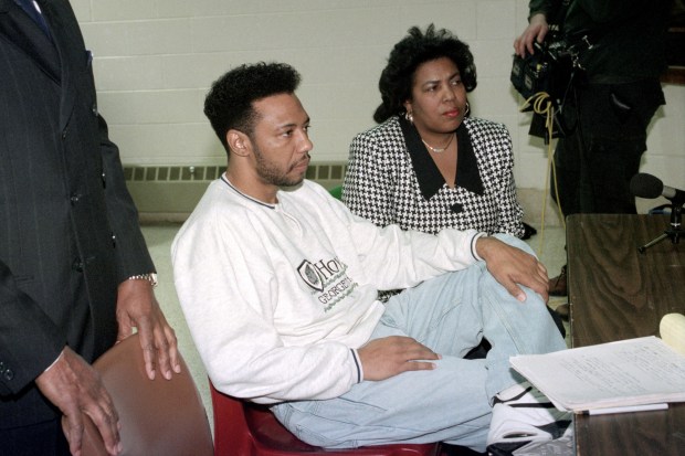 Larry Hoover, in prison since 1973, faces the parole board with his wife, Winndye Jenkins, at the Dixon Correctional Center on on Feb. 7, 1995. (John Dziekan/Chicago Tribune)