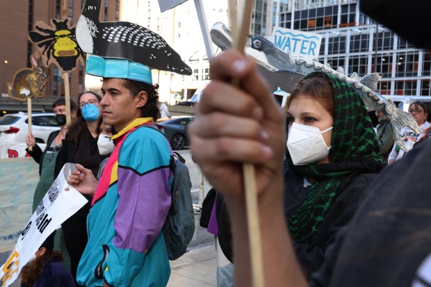 Activists attend a rally urging the Canadian government to shut down Enbridge's Line 5 pipeline on Oct. 23, 2024, in Chicago. (Stacey Wescott/Chicago Tribune)