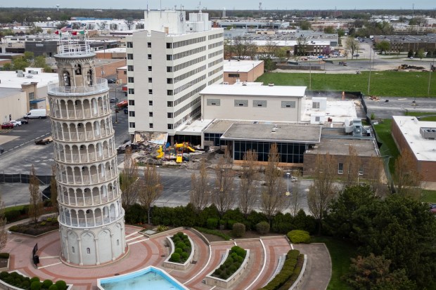 Demolition begins at the former Leaning Tower YMCA building in Niles, April 30, 2025. The Leaning Tower of Niles, the 90-year-old half-scale replica of the Leaning Tower of Pisa, will remain standing. (Audrey Richardson/Chicago Tribune)