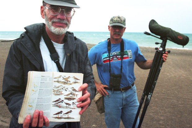 Al Stokie and Scott Hickman were part of a birdwatching team on July 8, 2001, looking for piping plovers at Illinois Beach State Park. (Jim Robinson/Chicago Tribune)