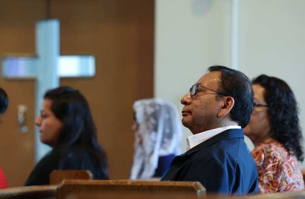 Julio Fernandez attends mass at the chapel inside St. Stanislaus Kostka School in Chicago with a group of volunteers who call themselves "Radio María" on May 13, 2025. (Stacey Wescott/Chicago Tribune)