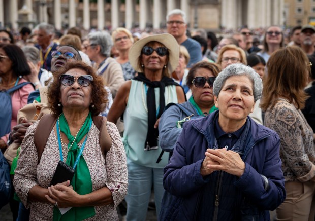 Attendees watch while Pope Leo XIV holds his first general audience, May 21, 2025, in St. Peter's Square at the Vatican. (Brian Cassella/Chicago Tribune)