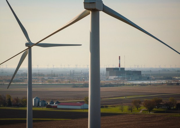 View looking south east in Marseilles of wind turbine towers and nuclear plant on April 23, 2025. (E. Jason Wambsgans/Chicago Tribune)