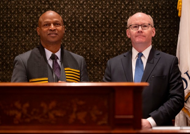 House Speaker Emanuel "Chris" Welch and Senate President Don Harmon stand on the dais together before Gov. JB Pritzker delivered his annual budget address on Feb. 19, 2025, at the Illinois State Capitol in Springfield. (Brian Cassella/Chicago Tribune/pool)