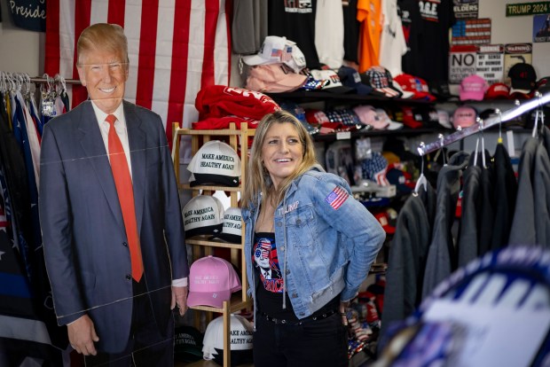 Lisa Fleischmann stands in her Trump Truth Store on May 4, 2025, in Huntley. The store's landlord has been cited for sign ordinance and building code violations in the past six months, according to public records. Fleischmann says she's being unfairly targeted by village officials for her political beliefs. (Brian Cassella/Chicago Tribune)